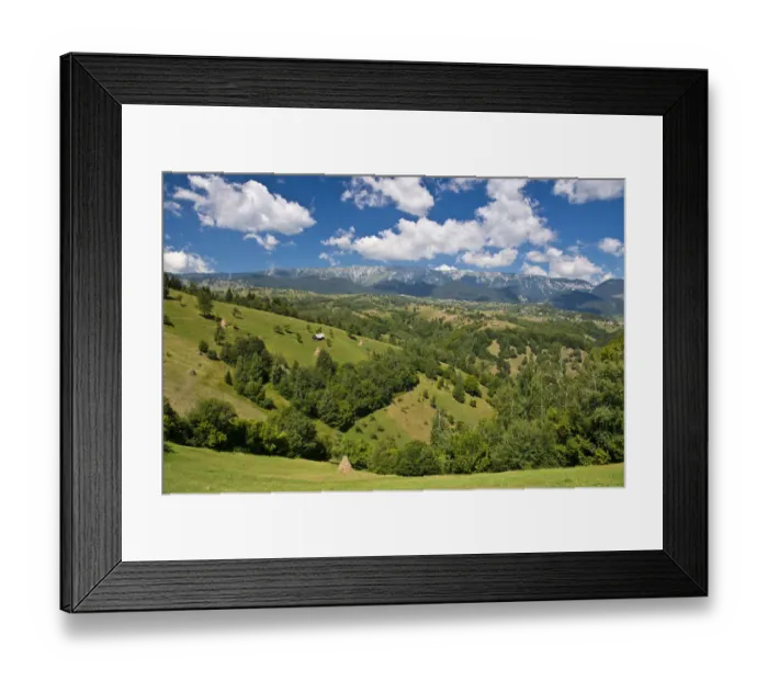 Framed Print : Mountain landscape with meadows in front of mountains, Carpathians, Romania Framed Print : Mountain landscape with meadows in front of mountains, Carpathians, Romania