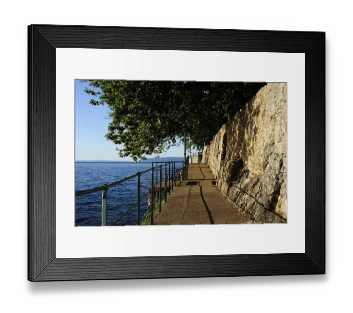 Framed Print : The boardwalk trail along the rocky coast, Lovran, Istria, Croatia Framed Print : The boardwalk trail along the rocky coast, Lovran, Istria, Croatia