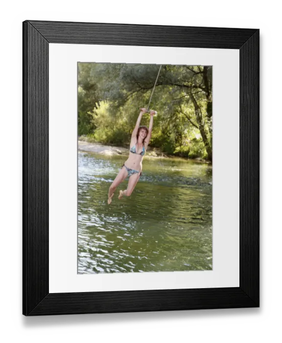 Framed Print : Woman jumping on a rope into the water, Birs River, Switzerland Framed Print : Woman jumping on a rope into the water, Birs River, Switzerland