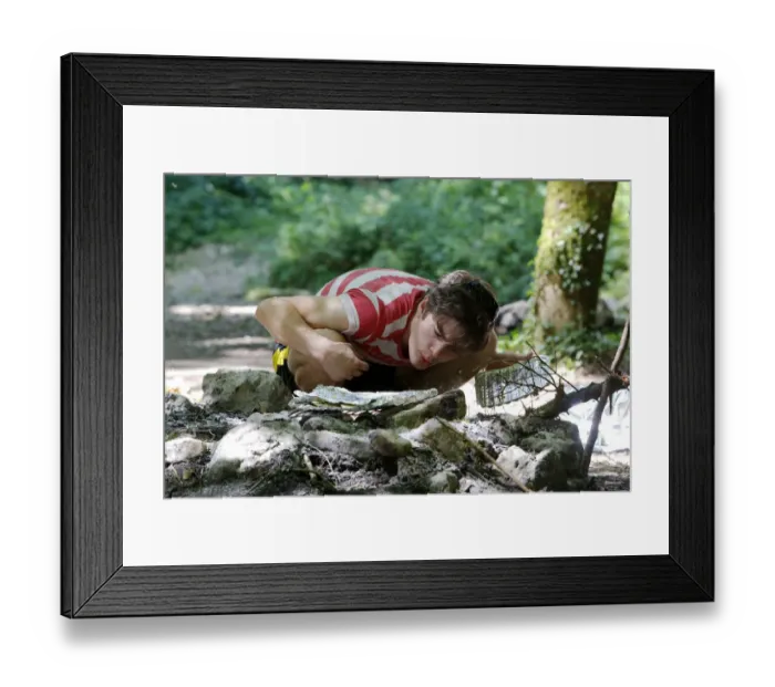 Framed Print : Man having a barbecue in a clearing Framed Print : Man having a barbecue in a clearing