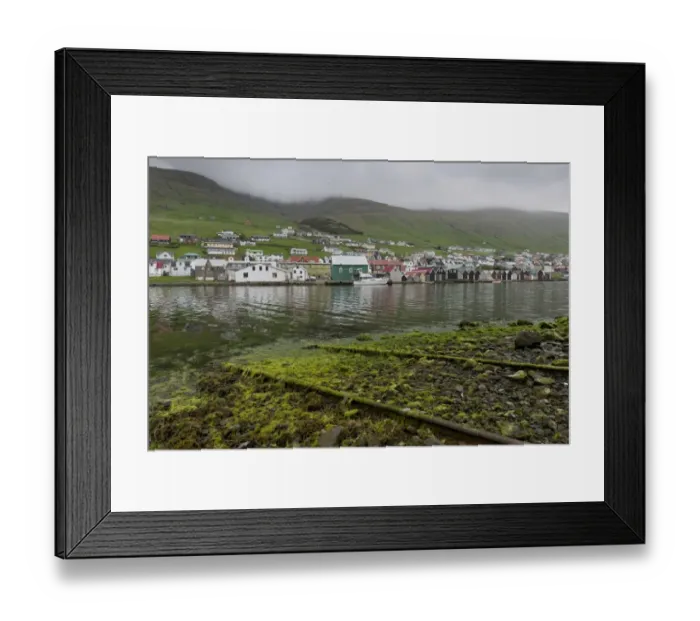 Framed Print : Rails on a boat ramp, covered in algae, boathouses at the back, Vagar, Faroe Islands, Denmark