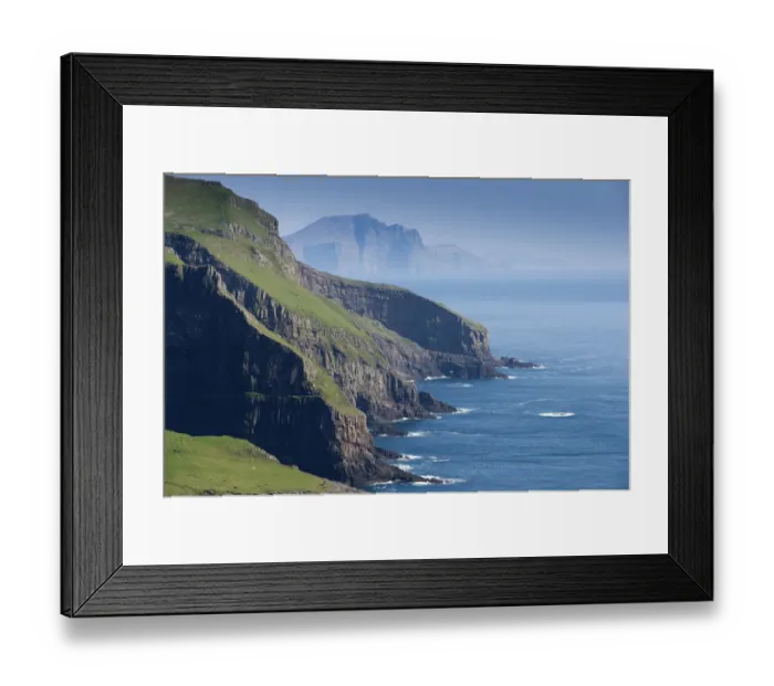 Framed Print : Rocky coast of Mykines, Vagar behind, Mykines, Utoyggjar, Faroe Islands, Denmark