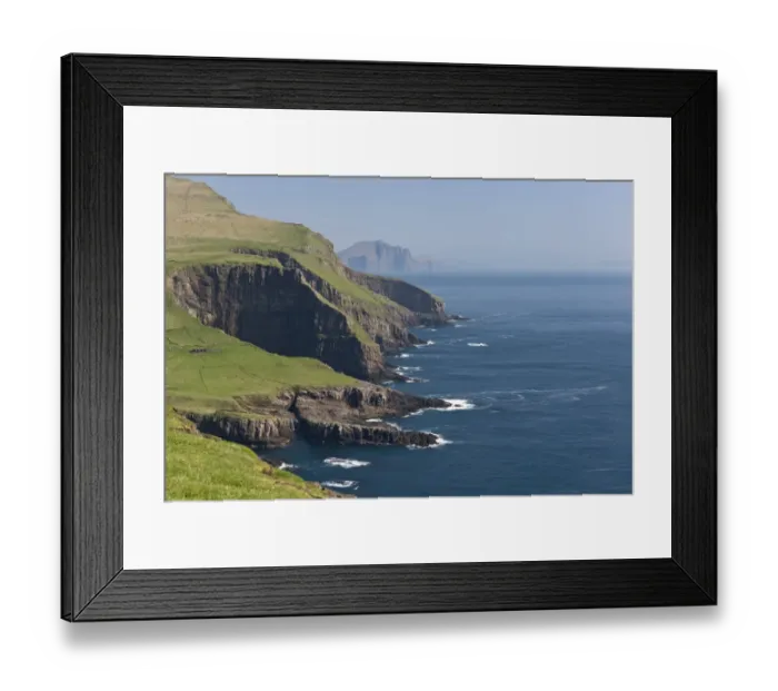 Framed Print : Rocky coast of Mykines, Vagar behind, Mykines, Utoyggjar, Faroe Islands, Denmark Framed Print : Rocky coast of Mykines, Vagar behind, Mykines, Utoyggjar, Faroe Islands, Denmark