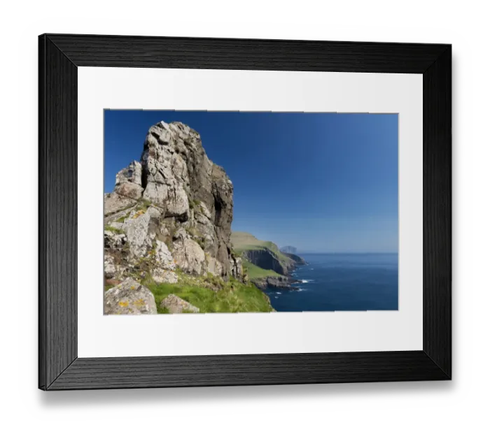 Framed Print : Rocky coast of Mykines, Vagar behind, Mykines, Utoyggjar, Faroe Islands, Denmark Framed Print : Rocky coast of Mykines, Vagar behind, Mykines, Utoyggjar, Faroe Islands, Denmark
