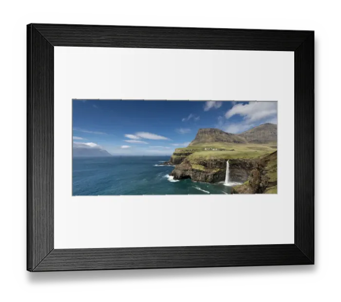 Framed Print : Cliffs with a waterfall near a village, Mykines Island at the rear, Gasadalur, Vagar, Faroe Islands, Denmark Framed Print : Cliffs with a waterfall near a village, Mykines Island at the rear, Gasadalur, Vagar, Faroe Islands, Denmark