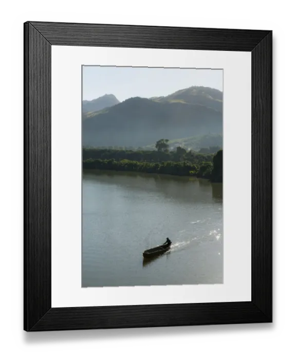 Framed Print : Man in a rowing boat, dug out canoe on a river in the morning, near Fort-Dauphin or Tolagnaro, Madagascar Framed Print : Man in a rowing boat, dug out canoe on a river in the morning, near Fort-Dauphin or Tolagnaro, Madagascar