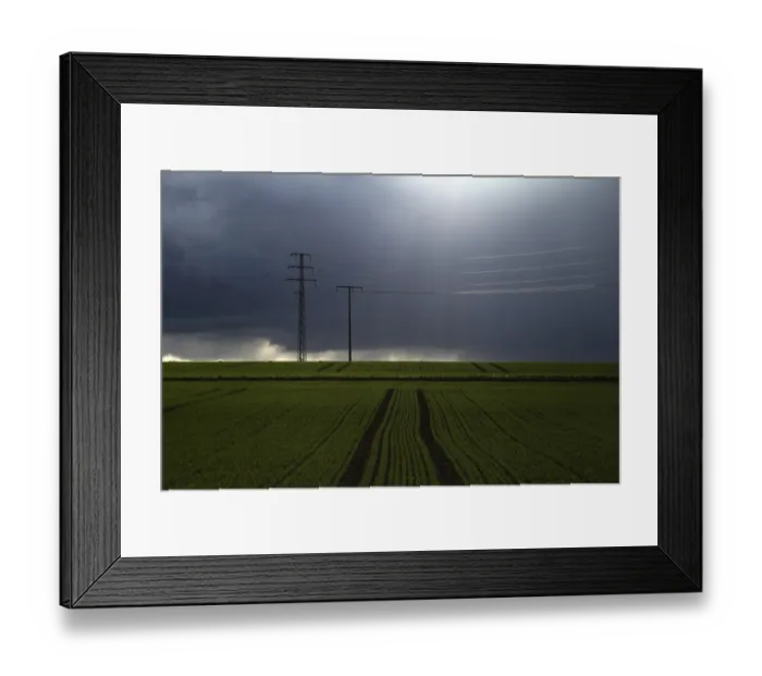 Framed Print : Stormy sky over fields with electricity pylons, Biberach, Upper Swabia, Baden-Wuerttemberg, Germany
