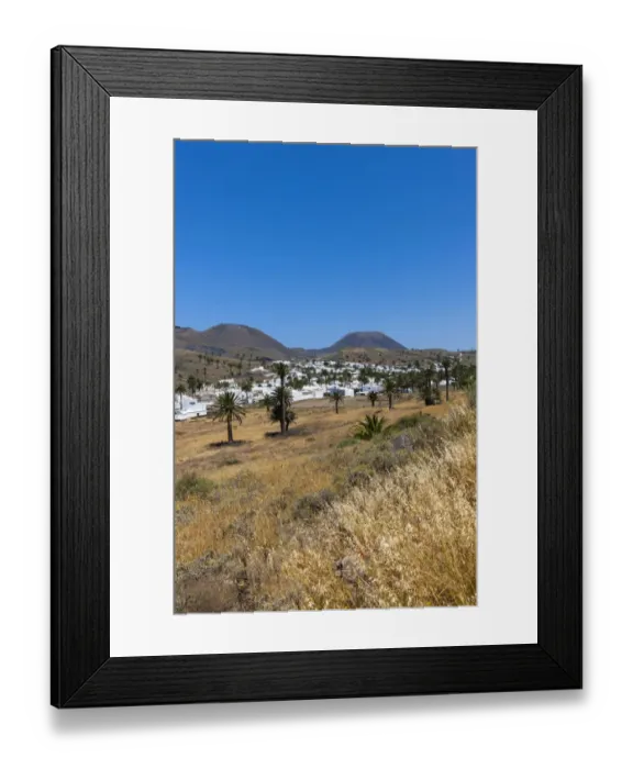 Framed Print : The mountain village of Haria, with its white houses, the volcano Monte Corona at the back, Maguez, Lanzarote, Canary Islands, Spain Framed Print : The mountain village of Haria, with its white houses, the volcano Monte Corona at the back, Maguez, Lanzarote, Canary Islands, Spain