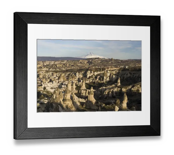 Framed Print : The village of Goreme in front of the snow-capped volcano Erciyes Dagi, Cappadocia, Turkey Framed Print : The village of Goreme in front of the snow-capped volcano Erciyes Dagi, Cappadocia, Turkey