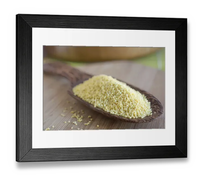 Framed Print : Millet grains on a wooden scoop made of coconut wood Framed Print : Millet grains on a wooden scoop made of coconut wood