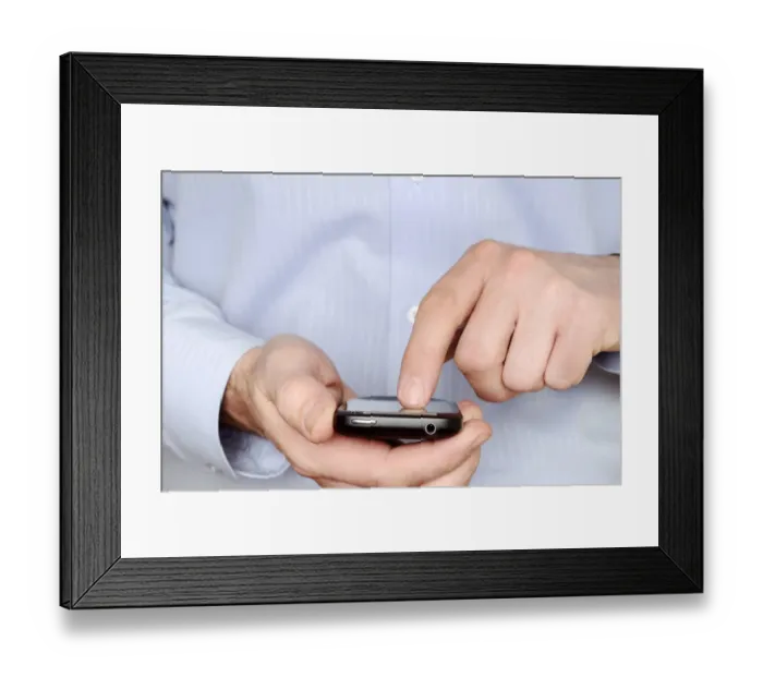 Framed Print : Man using a smartphone Framed Print : Man using a smartphone