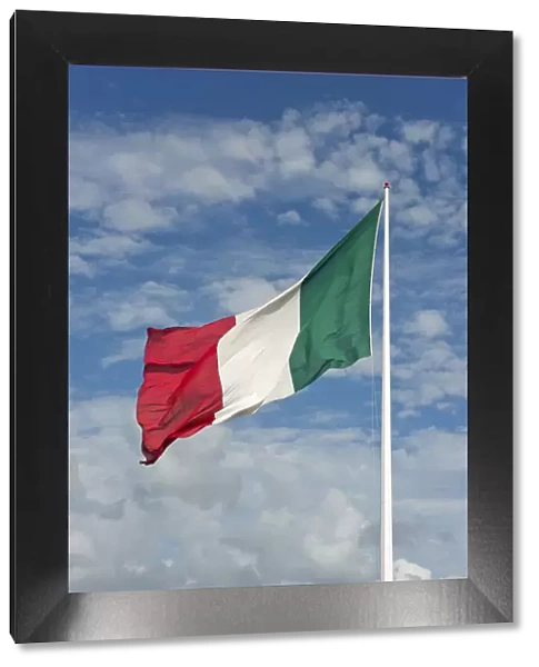 Italian flag against cloudy sky