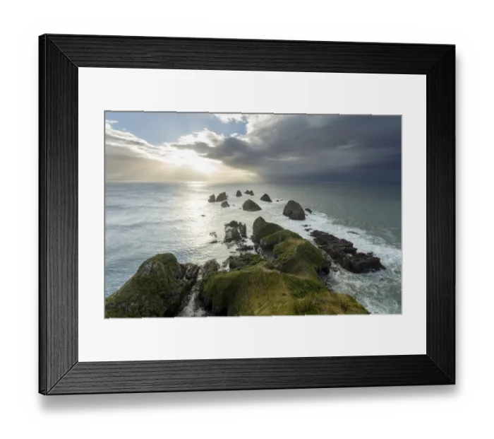 Framed Print : Cliffs rising from the Pacific with a rising sun, at Nugget Point, Nugget Point, Ahuriri Flat, Otago Region, New Zealand Framed Print : Cliffs rising from the Pacific with a rising sun, at Nugget Point, Nugget Point, Ahuriri Flat, Otago Region, New Zealand