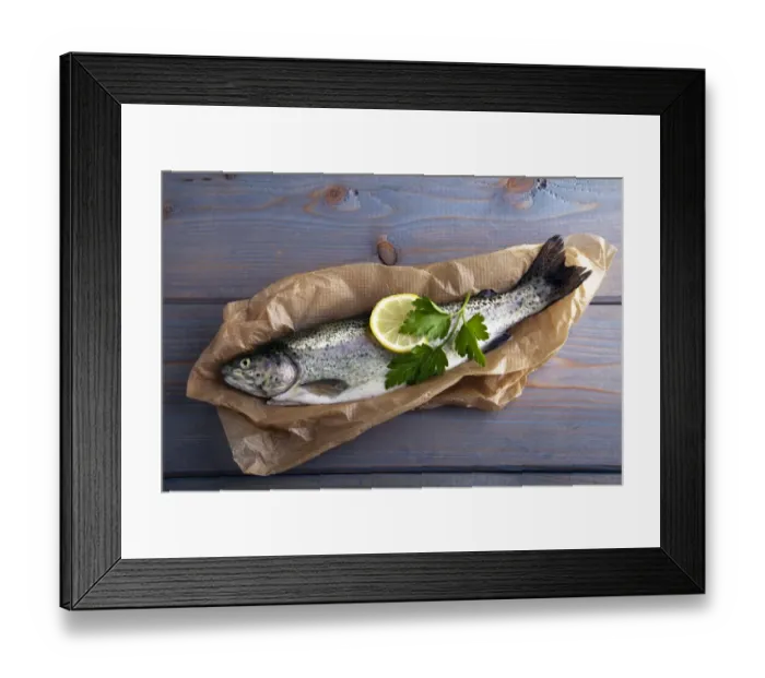 Framed Print : Fresh brook trout in baking paper on a wooden surface Framed Print : Fresh brook trout in baking paper on a wooden surface