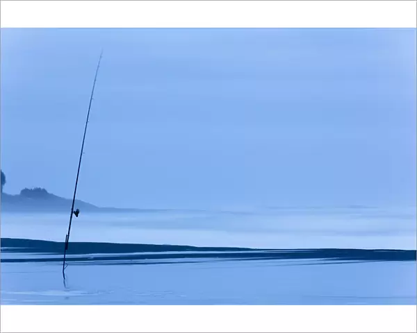 Fishing rod on the beach at dusk, Oakura, Taranaki Region, New Zealand