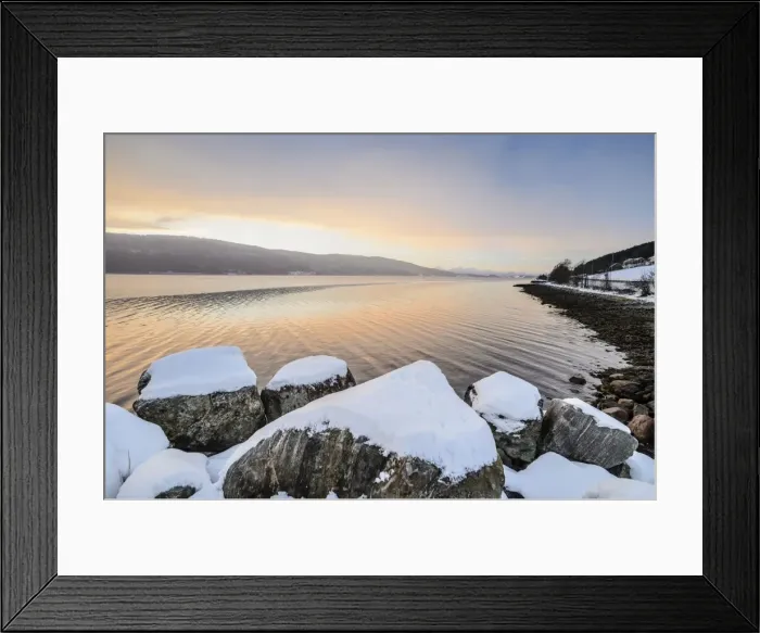 Framed Print : Winter atmosphere at sunrise on the fjord, snow-covered rocks, coastal road, near Alesund, Norway Framed Print : Winter atmosphere at sunrise on the fjord, snow-covered rocks, coastal road, near Alesund, Norway