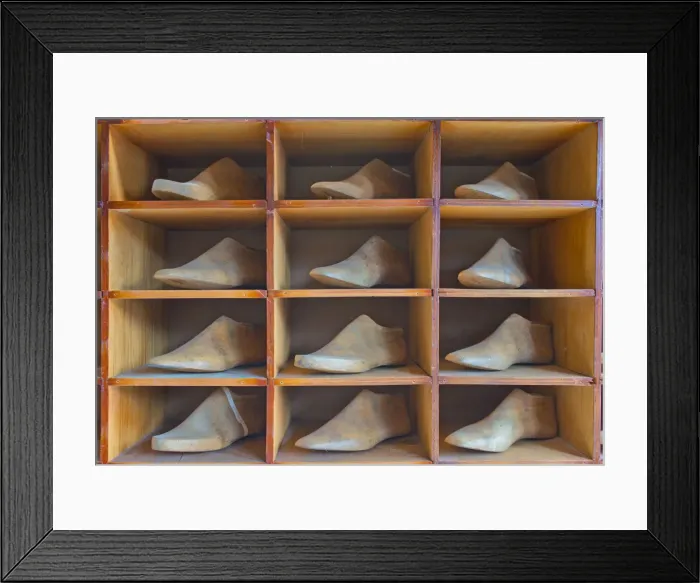 Framed Print : Shelf with antique lasts for manufacturing shoes Framed Print : Shelf with antique lasts for manufacturing shoes