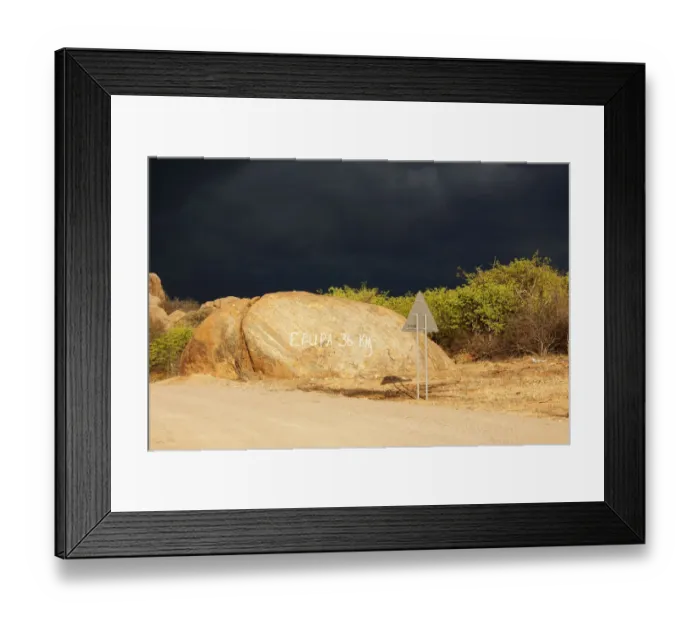 Framed Print : Dark storm front over rocks with signpost Epupa 36 km, Kaokoland, Kunene, Namibia Framed Print : Dark storm front over rocks with signpost Epupa 36 km, Kaokoland, Kunene, Namibia
