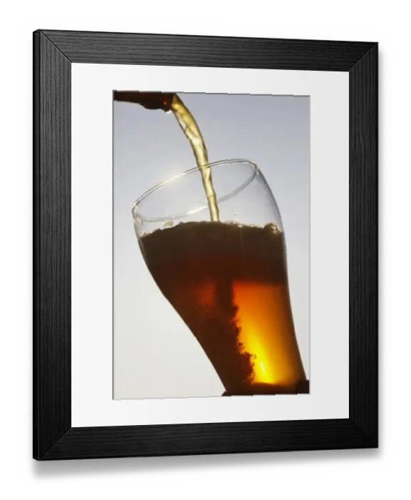 Framed Print : Hefeweizen, wheat beer being poured Framed Print : Hefeweizen, wheat beer being poured