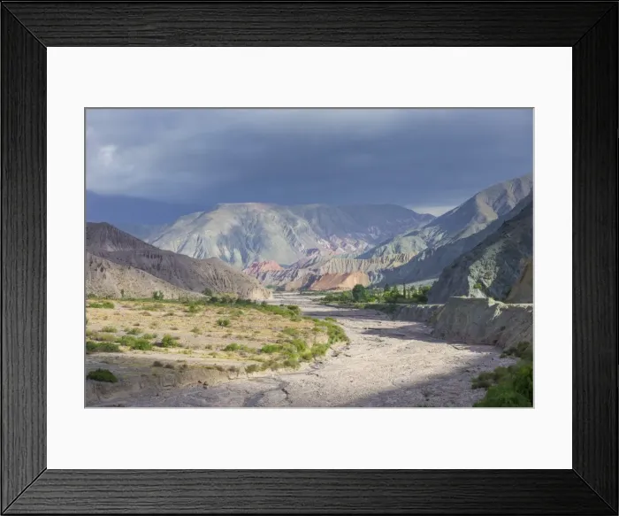 Framed Print : Riverbed of the Purmamarca and Cerro de los Siete Colores or Hill of Seven Colors in Purmamarca, Jujuy Province, Argentina