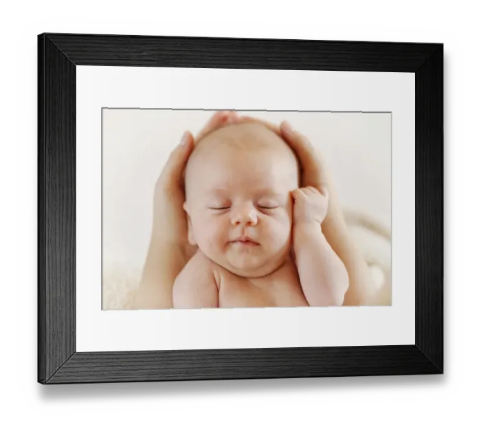 Framed Print : Baby girl, 3 months, being held by hands, portrait