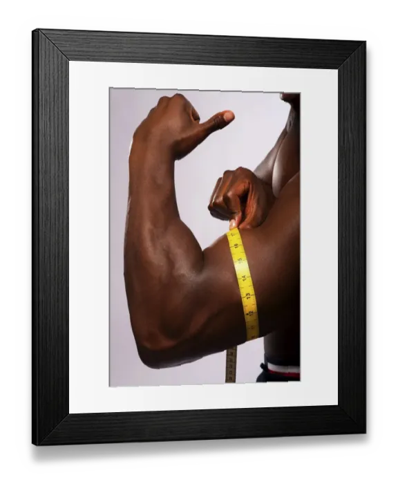Framed Print : Man measuring his biceps with a tape measure Framed Print : Man measuring his biceps with a tape measure