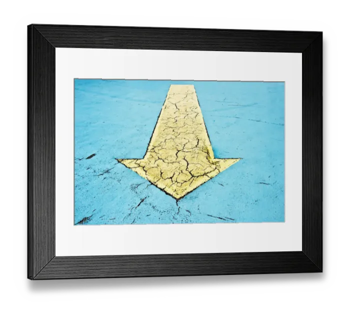 Framed Print : Yellow arrow on blue asphalt Framed Print : Yellow arrow on blue asphalt