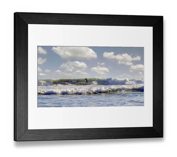 Framed Print : Surfer in the surf on the Pacific beach near Cambria, California, United States Framed Print : Surfer in the surf on the Pacific beach near Cambria, California, United States