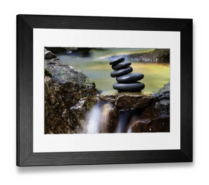 Framed Print : Cairn, stack of basalt rocks in a creek