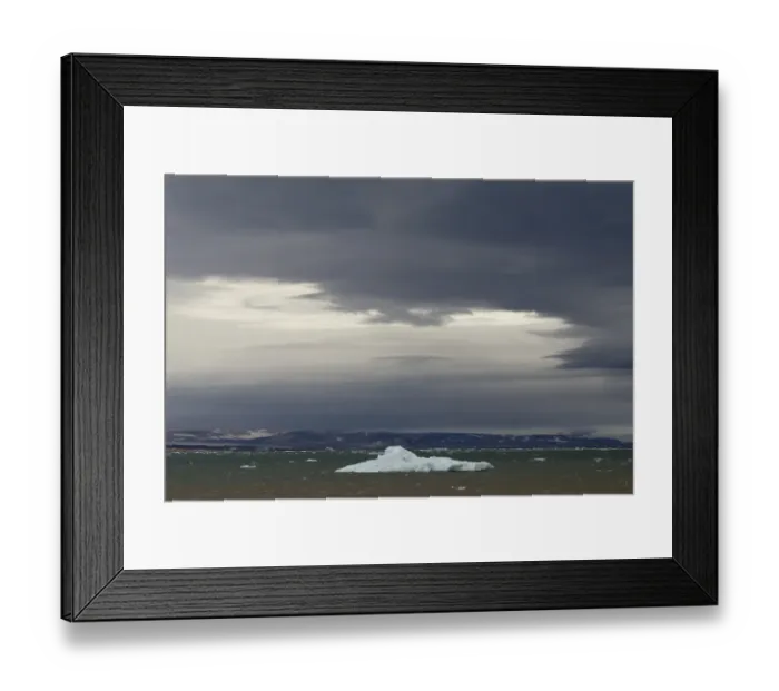 Framed Print : Iceberg floating in Palanderbukta fjord during strong winds and storm clouds, Nordaustlandet, Svalbard Archipelago, Svalbard and Jan Mayen, Norway Framed Print : Iceberg floating in Palanderbukta fjord during strong winds and storm clouds, Nordaustlandet, Svalbard Archipelago, Svalbard and Jan Mayen, Norway