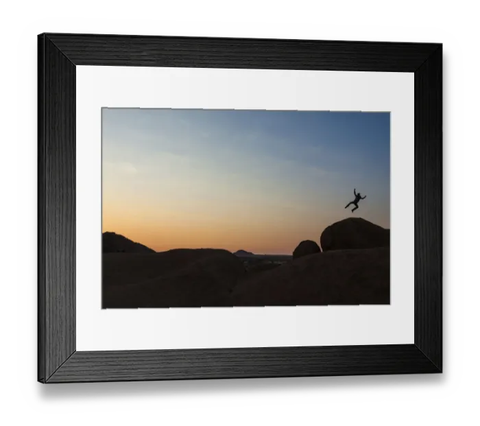 Framed Print : Young man jumping, granite rocks, near Spitzkoppe granite peaks, Damaraland, Namibia, Africa Framed Print : Young man jumping, granite rocks, near Spitzkoppe granite peaks, Damaraland, Namibia, Africa