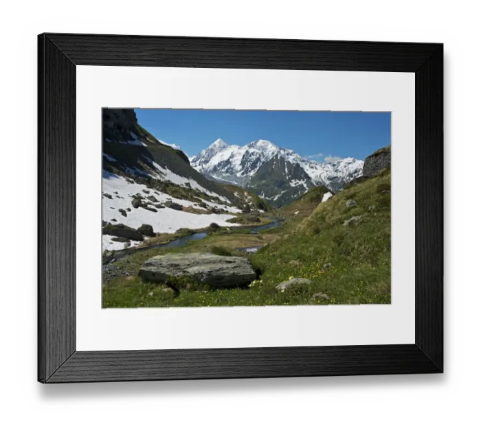 Framed Print : Valley with the Louvie stream in an alpine landscape with the peaks of Combin de Corbassiere Mountain, left, and Petit Combin Mountain, right, Val de Bagnes valley, Canton of Valais, Switzerland Framed Print : Valley with the Louvie stream in an alpine landscape with the peaks of Combin de Corbassiere Mountain, left, and Petit Combin Mountain, right, Val de Bagnes valley, Canton of Valais, Switzerland