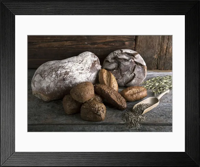 Framed Print : Bread loaves, rolls with rye grain and ears of corn on a rustic wooden surface Framed Print : Bread loaves, rolls with rye grain and ears of corn on a rustic wooden surface
