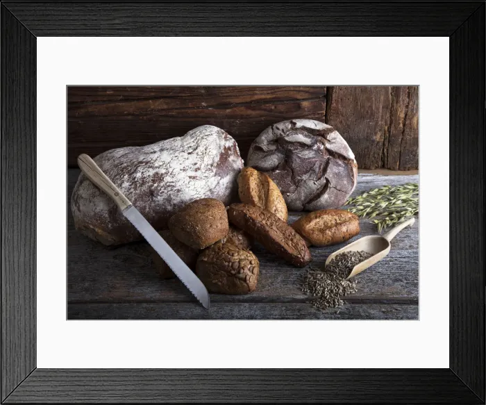 Framed Print : Bread loaves, rolls and a bread knife, rye grain and ears of corn on a rustic wooden surface Framed Print : Bread loaves, rolls and a bread knife, rye grain and ears of corn on a rustic wooden surface