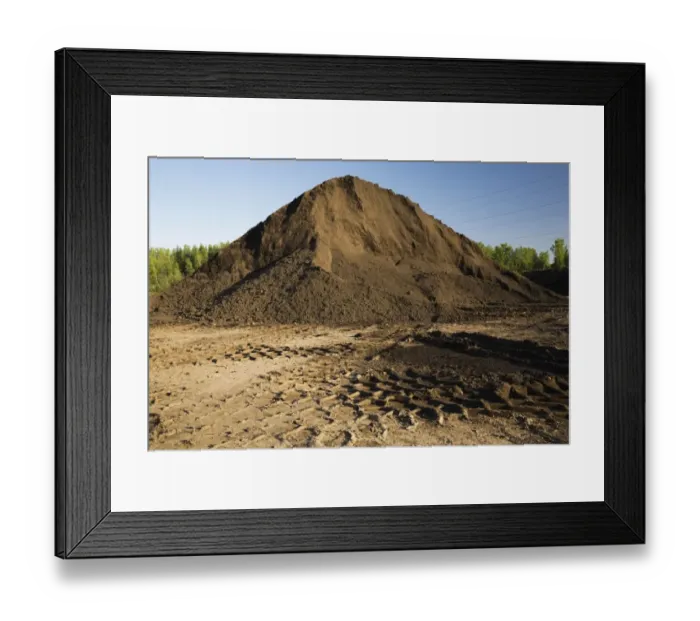 Framed Print : Heavy tire tracks and a mound of topsoil in a commercial sandpit, Quebec, Canada Framed Print : Heavy tire tracks and a mound of topsoil in a commercial sandpit, Quebec, Canada