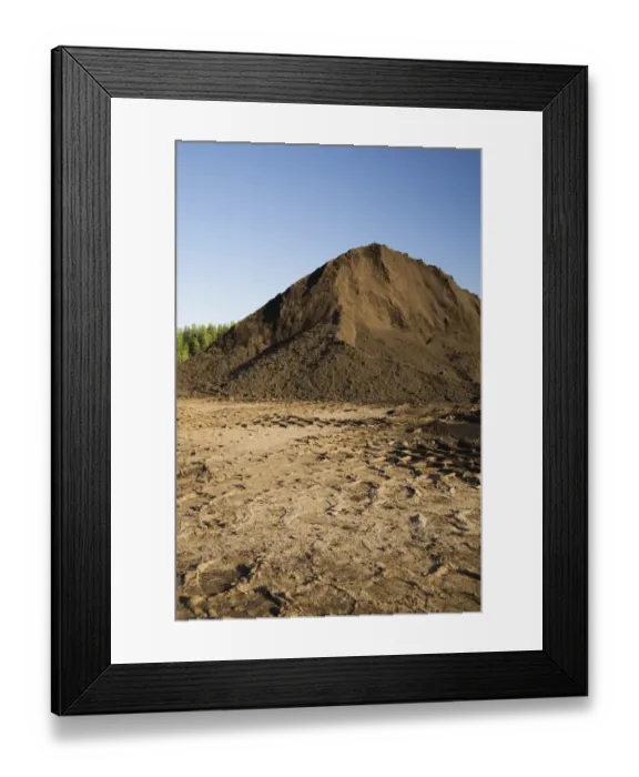 Framed Print : Heavy tire tracks and a mound of topsoil in a commercial sandpit, Quebec, Canada Framed Print : Heavy tire tracks and a mound of topsoil in a commercial sandpit, Quebec, Canada