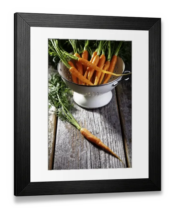 Framed Print : Fresh carrots, carrots in a colander on rustic wood Framed Print : Fresh carrots, carrots in a colander on rustic wood