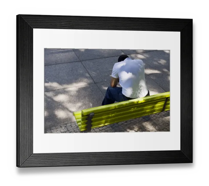 Framed Print : Man with bowed head sitting on a green park bench, Berlin, Germany, Europe Framed Print : Man with bowed head sitting on a green park bench, Berlin, Germany, Europe