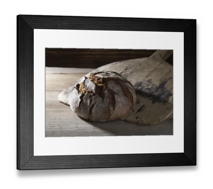Framed Print : Freshly baked farmhouse bread on an old bread slide Framed Print : Freshly baked farmhouse bread on an old bread slide