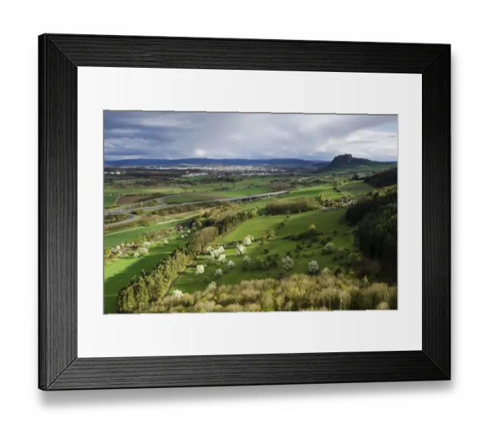 Framed Print : View from Hohenkraehen Mountain over the spring-like Hegau landscape, Hohentwiel Mountain on the horizon and the town of Singen, Baden-Wuerttemberg, Germany, Europe Framed Print : View from Hohenkraehen Mountain over the spring-like Hegau landscape, Hohentwiel Mountain on the horizon and the town of Singen, Baden-Wuerttemberg, Germany, Europe