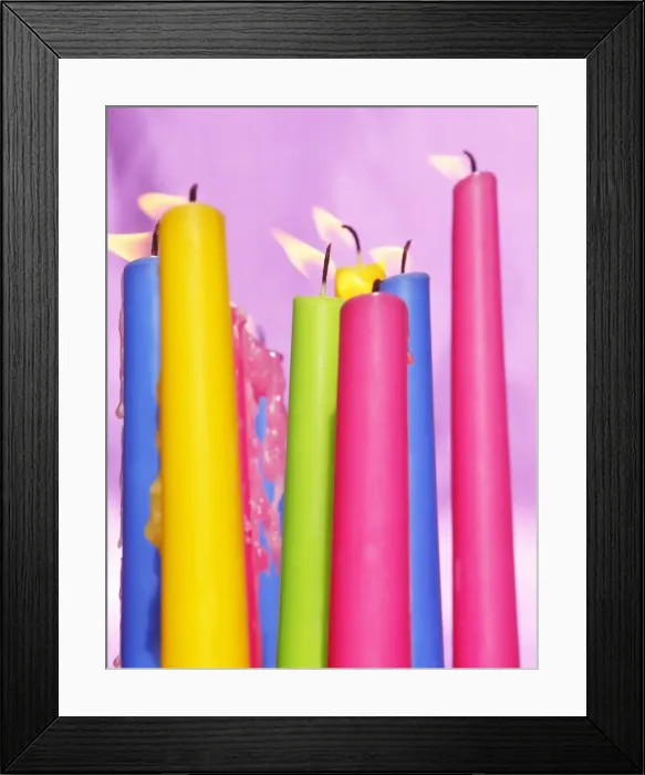 Framed Print : Colourful candles blowing in the wind Framed Print : Colourful candles blowing in the wind