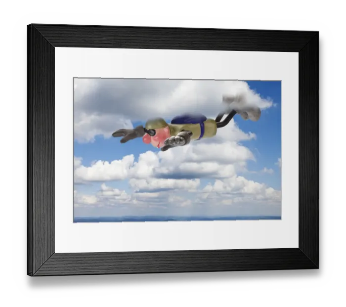 Framed Print : Cartoon character BASE jumper in gliding flight through clouds Framed Print : Cartoon character BASE jumper in gliding flight through clouds
