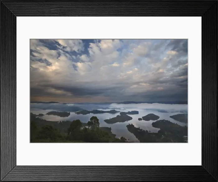 Framed Print : Dramatic clouds and fog at sunrise above the islands of Bunyonyi Lake, Kisoro, southwestern Uganda Framed Print : Dramatic clouds and fog at sunrise above the islands of Bunyonyi Lake, Kisoro, southwestern Uganda