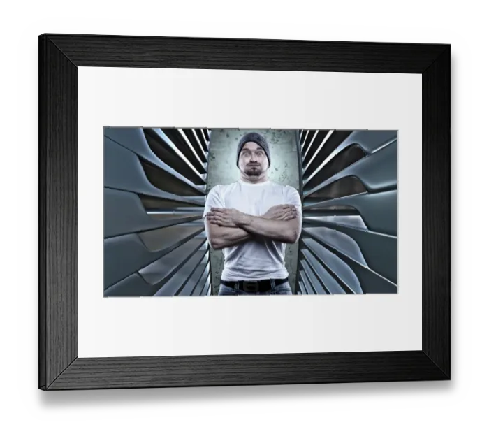 Framed Print : Man posing like a macho with his arms crossed