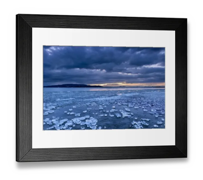 Framed Print : Chunks of ice lying on icy surface on the shore of Reichenau Island, Baden-Wuerttemberg, Germany, Europe Framed Print : Chunks of ice lying on icy surface on the shore of Reichenau Island, Baden-Wuerttemberg, Germany, Europe