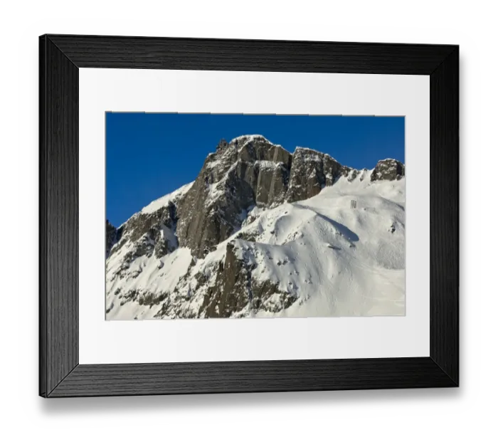 Framed Print : Snow-covered peaks of Le Brevent Mountain with the mountain station of the cable car, tracks from deep snow riders on the steep slopes, Chamonix ski resort, France, Europe Framed Print : Snow-covered peaks of Le Brevent Mountain with the mountain station of the cable car, tracks from deep snow riders on the steep slopes, Chamonix ski resort, France, Europe