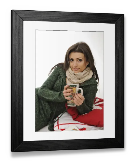 Framed Print : Young woman holding a large tea mug Framed Print : Young woman holding a large tea mug