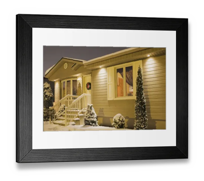 Framed Print : Bungalow style residential home illuminated in winter at dusk with Christmas decorations, Quebec, Canada Framed Print : Bungalow style residential home illuminated in winter at dusk with Christmas decorations, Quebec, Canada