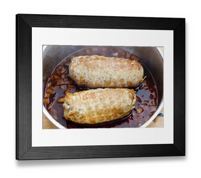 Framed Print : Pork roulade in a net in a casserole pot Framed Print : Pork roulade in a net in a casserole pot