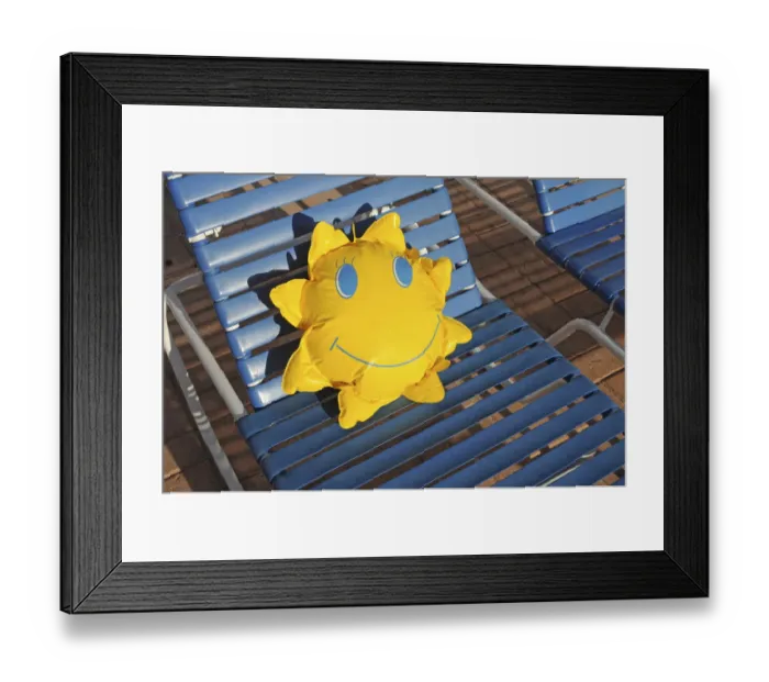 Framed Print : Toy sun lying on a sun lounger Framed Print : Toy sun lying on a sun lounger